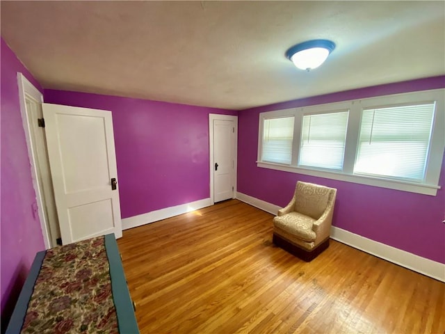 unfurnished room with light wood-type flooring