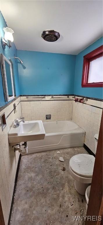 147 Montana Ave, Buffalo, NY 14211 - full bathroom with toilet, tile walls, wainscoting, and a bath