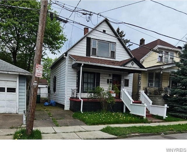 147 Montana Ave, Buffalo, NY 14211 - bungalow-style home with covered porch, an outdoor structure, a garage, and a chimney