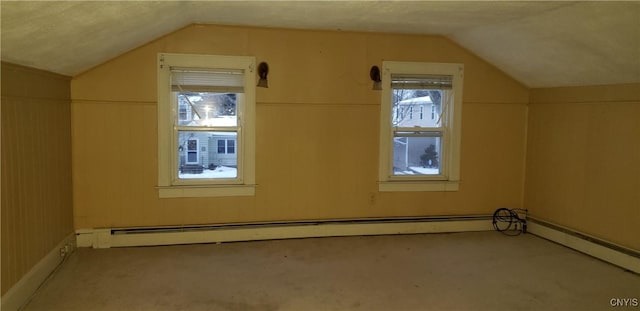 bonus room featuring vaulted ceiling and a textured ceiling