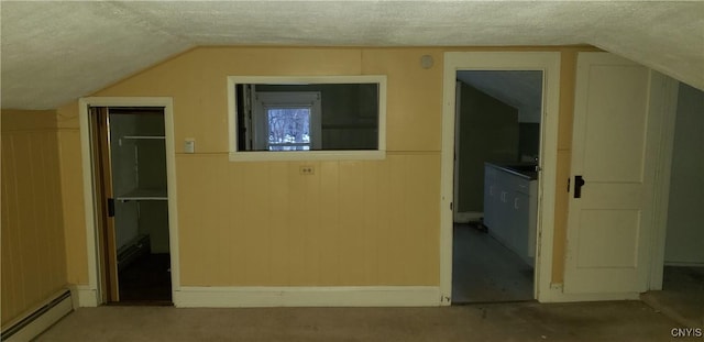 bonus room with a baseboard radiator, a textured ceiling, and lofted ceiling