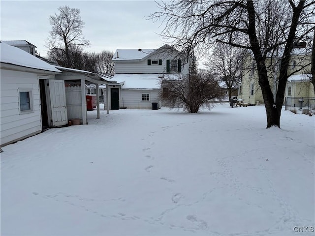 view of yard layered in snow