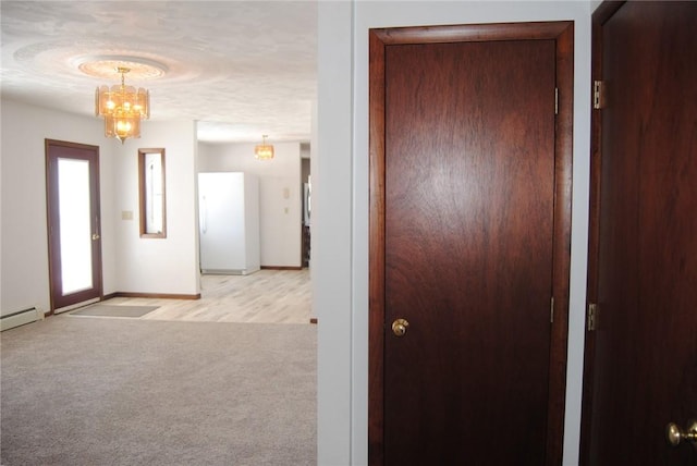 516 N Tionesta Ave, Kane Boro, PA 16735 - hall featuring a chandelier, light carpet, and baseboard heating