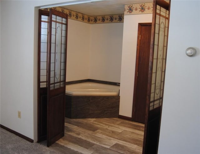 516 N Tionesta Ave, Kane Boro, PA 16735 - bathroom with a bath and wood finished floors