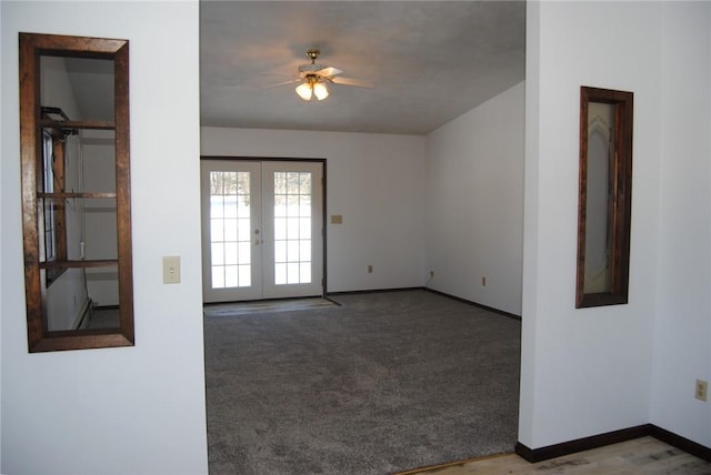 empty room with ceiling fan, french doors, and carpet flooring