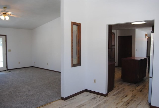 spare room featuring light hardwood / wood-style flooring and ceiling fan