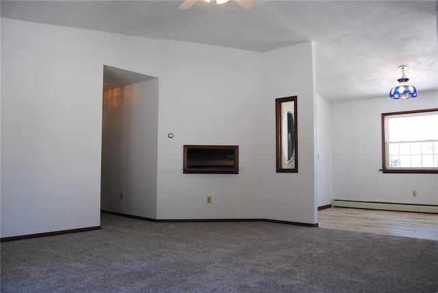 516 N Tionesta Ave, Kane Boro, PA 16735 - carpeted spare room featuring a baseboard heating unit and ceiling fan