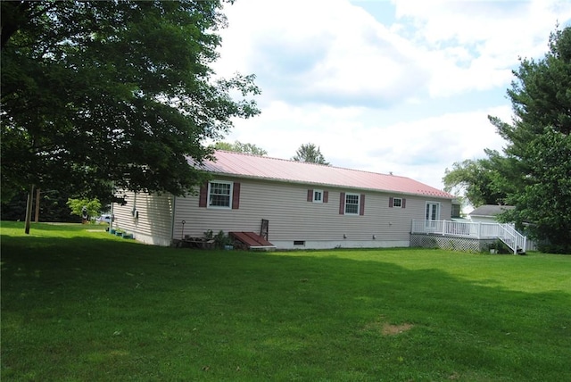 516 N Tionesta Ave, Kane Boro, PA 16735 - rear view of property featuring a yard, a metal roof, and a deck