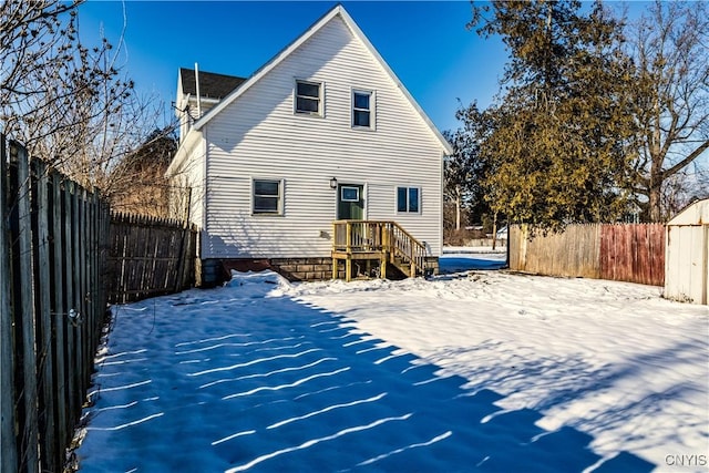 view of snow covered house