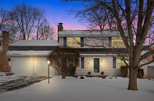 view of front of property featuring a garage