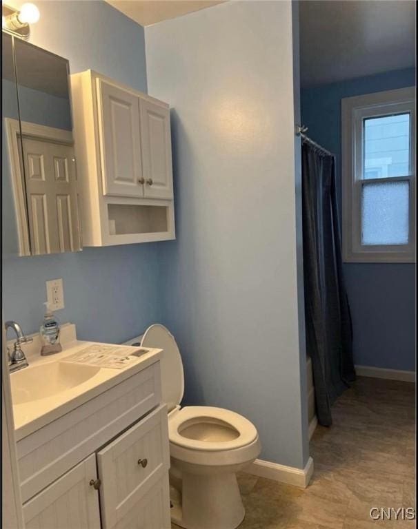 full bathroom with vanity, toilet, and shower / bathtub combination with curtain