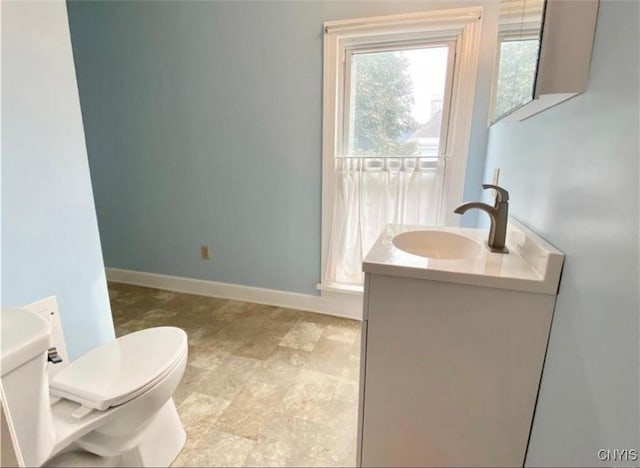 bathroom with toilet and vanity