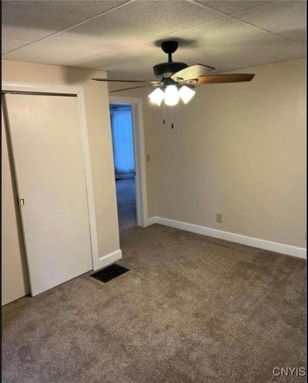 unfurnished bedroom with ceiling fan and carpet