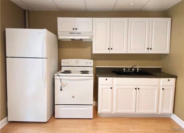 kitchen with sink, white appliances, white cabinets, and light hardwood / wood-style floors