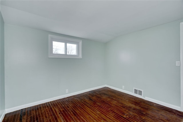 unfurnished room featuring hardwood / wood-style flooring