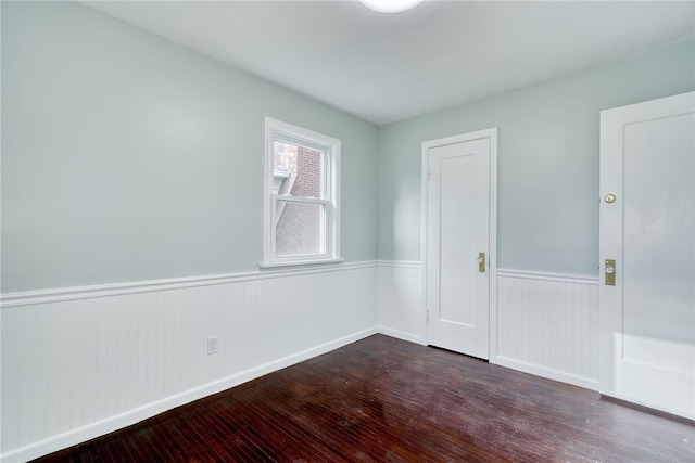 empty room featuring dark hardwood / wood-style floors