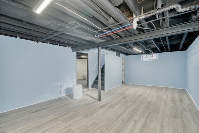 basement featuring hardwood / wood-style flooring