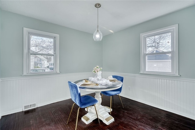 dining space with hardwood / wood-style floors