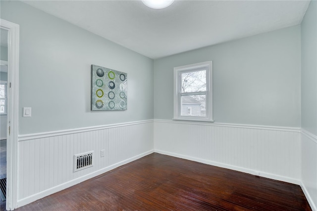 empty room with wood-type flooring