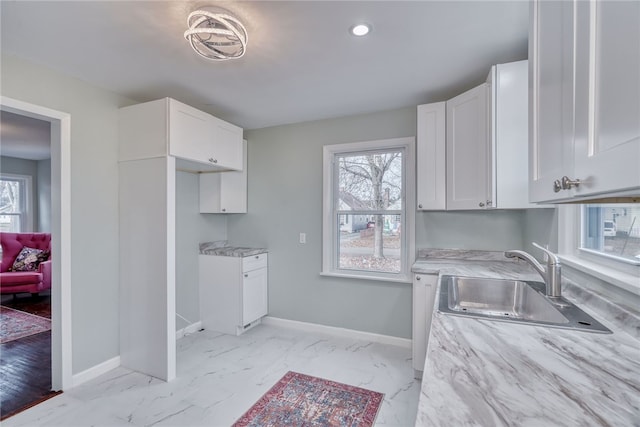 kitchen with white cabinets and sink