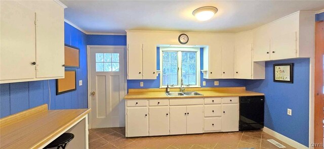 kitchen featuring sink, white cabinetry, dishwasher, and crown molding