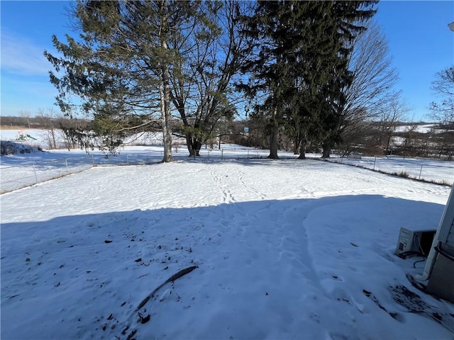 view of yard layered in snow