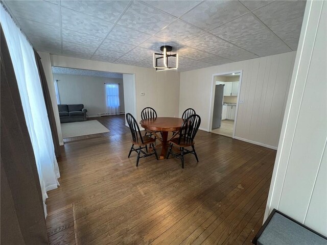 dining area featuring wood-type flooring