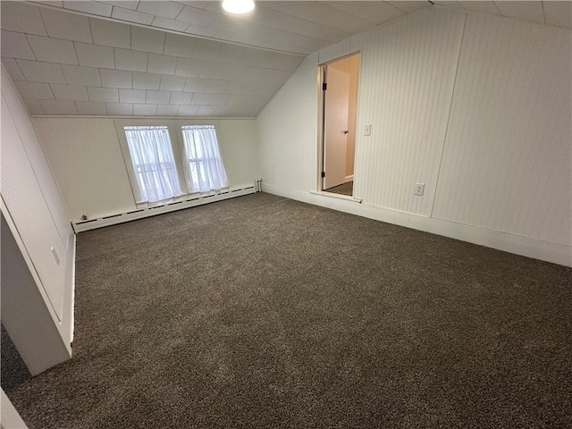 bonus room with lofted ceiling, dark carpet, and baseboard heating