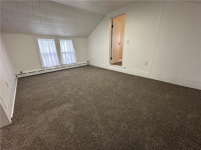 8074 State Route 90, Montezuma, NY 13040 - bonus room featuring lofted ceiling, dark colored carpet, and a baseboard radiator