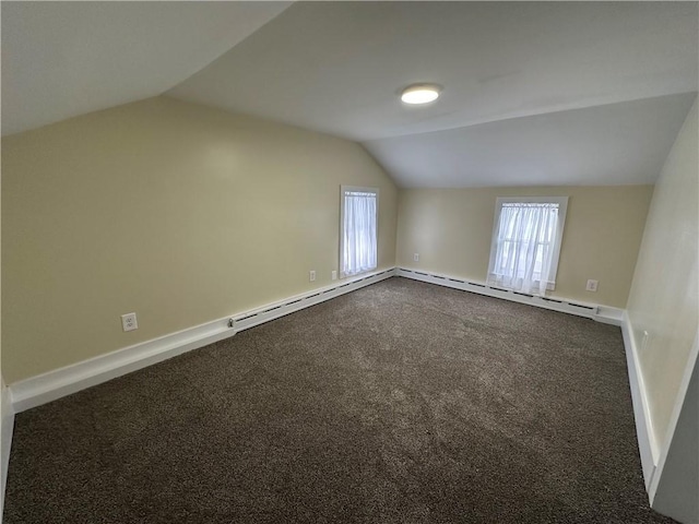 bonus room with lofted ceiling and carpet flooring