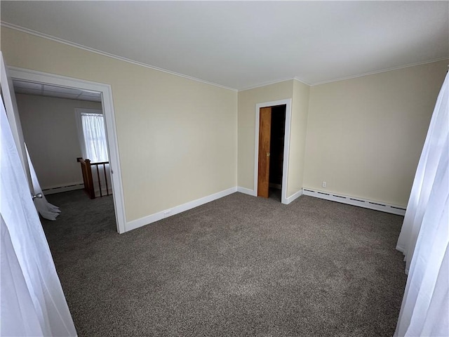 unfurnished bedroom with baseboard heating, ornamental molding, and dark colored carpet