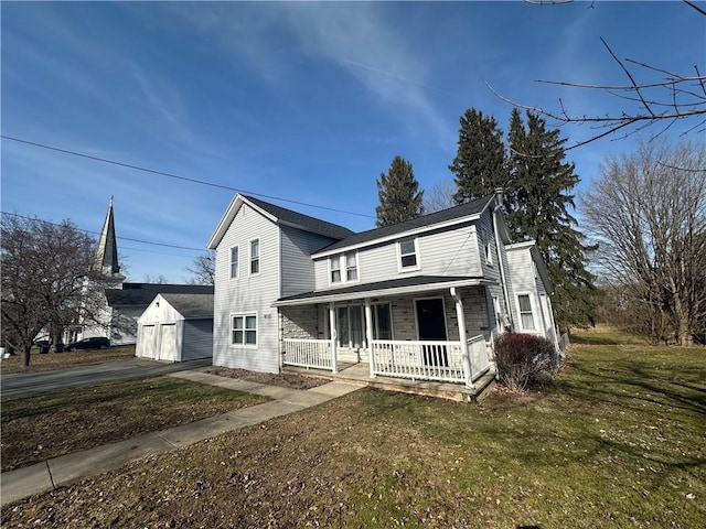 8074 State Route 90, Montezuma, NY 13040 - view of front of home with a front yard, driveway, covered porch, an outdoor structure, and a detached garage