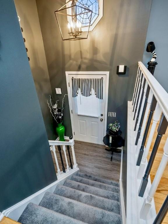 foyer featuring a notable chandelier and wood-type flooring