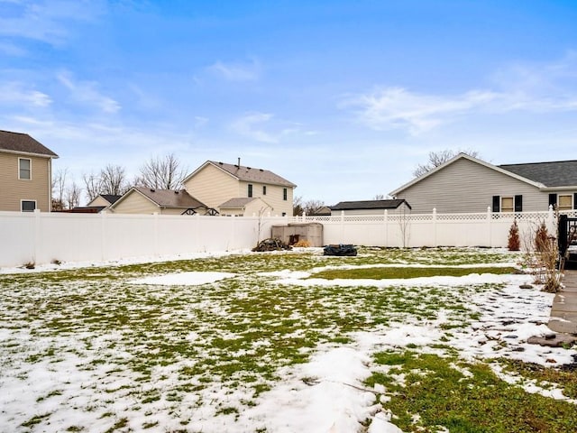 view of yard covered in snow