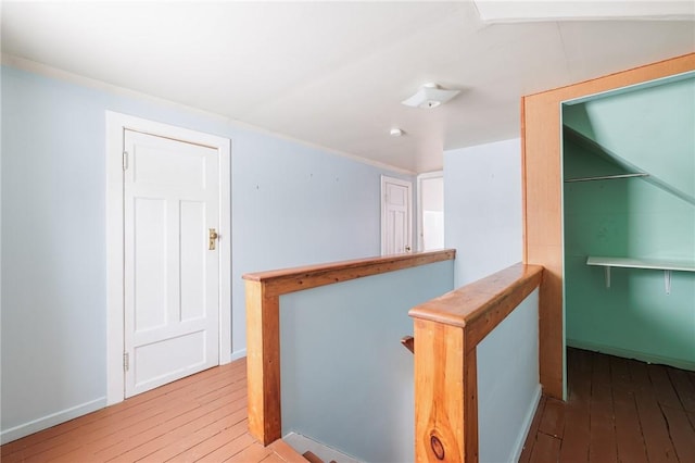 corridor featuring hardwood / wood-style floors