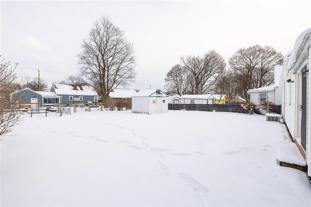 view of yard layered in snow