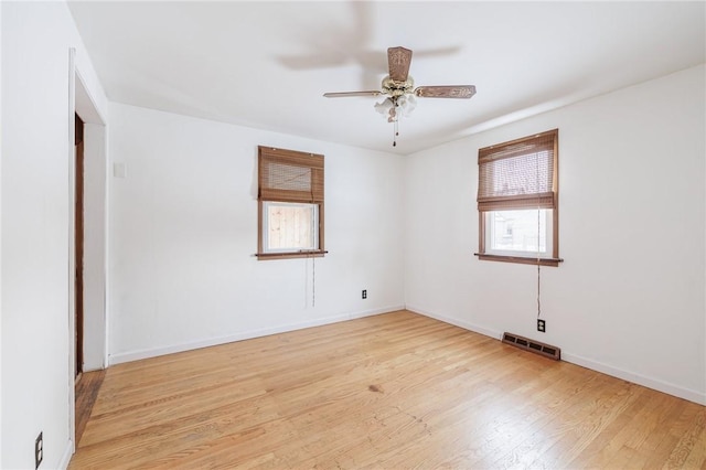 spare room with light hardwood / wood-style flooring and ceiling fan