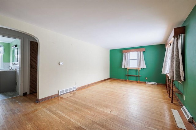 unfurnished room with light hardwood / wood-style flooring