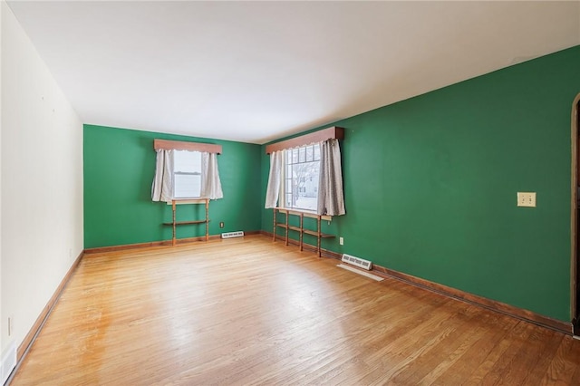 empty room featuring wood-type flooring