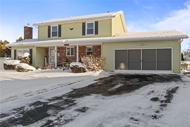 front of property with a garage