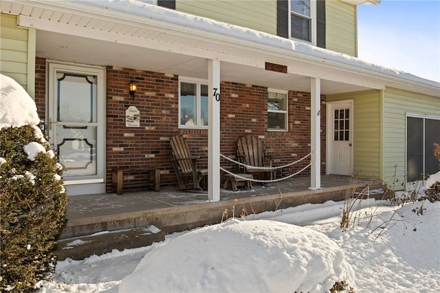 view of snow covered property entrance