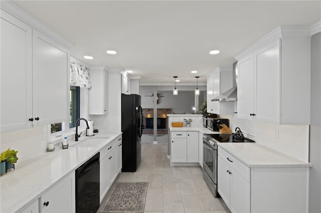 kitchen featuring black appliances, white cabinetry, sink, hanging light fixtures, and backsplash