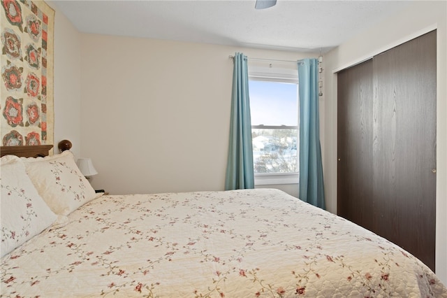 bedroom featuring ceiling fan and multiple windows