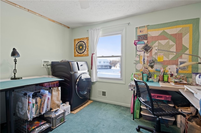 washroom with washer hookup, a textured ceiling, and carpet flooring