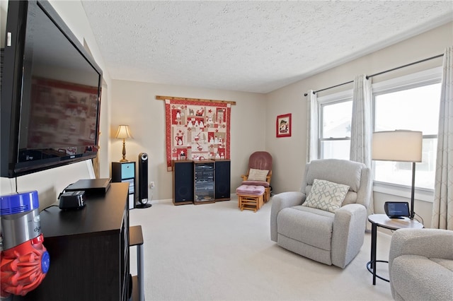 interior space featuring a textured ceiling and carpet