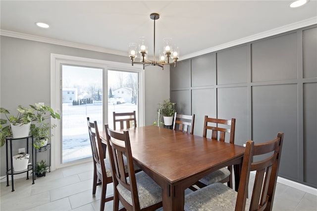 dining space with ornamental molding, a chandelier, and light tile patterned flooring