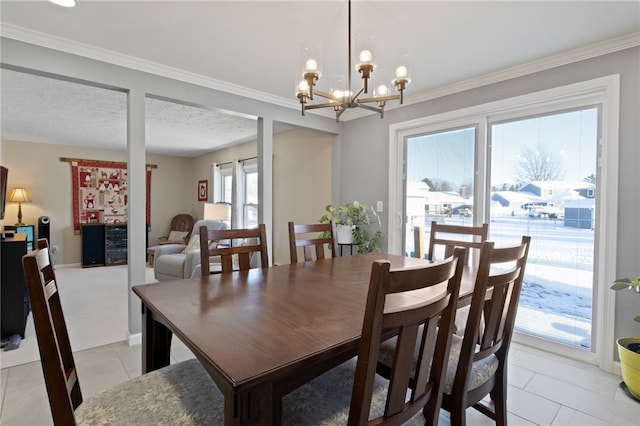 dining room featuring a textured ceiling, light tile patterned floors, and a healthy amount of sunlight