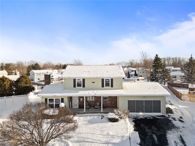 front of property with a garage