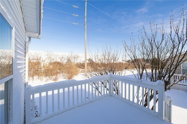 view of snow covered deck