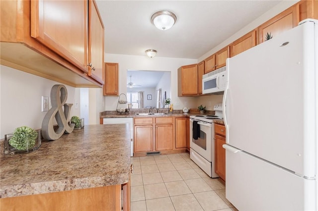 kitchen with ceiling fan, sink, white appliances, and light tile patterned floors